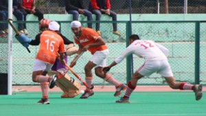 Players displaying dodging skill during a match of 4th All India Police Martyrs Memorial Hockey Tournament at KK Hakhu Stadium in Jammu on Wednesday. 