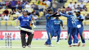 Sri Lanka players celebrating dismissal of Ian Bell during their victory against England in WC match on Sunday.