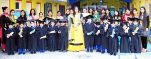 Students of Little Champs Playway School posing for a group photograph during prize distribution ceremony on Saturday.