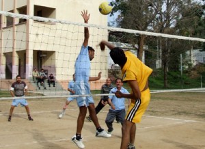 Players in action during a final match of the volleyball tournament at RRL School ground, Jammu on Thursday.