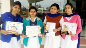 Winners of various competitions displaying certificates while posing for a group photograph at KC Gurukul College in Jammu. 