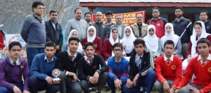 Winners of Painting-cum-Quiz Competition posing alongwith the dignitaries at GHSS Boys in Doda.