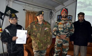 Army officer presenting temporary driving licence to a student. 
