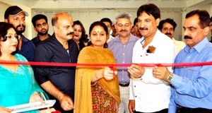 Minister of State for Education inaugurating photo exhibition at Jammu on Wednesday.