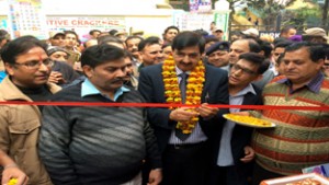 Minister of State for Finance, Pawan Kumar Gupta inaugurating a JCB machine at Udhampur on Wednesday.