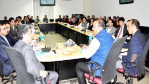 Minister for Industries & Commerce Chander Prakash chairing high level meeting of officers at Jammu on Thursday.