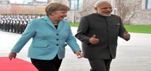 Prime Minister Narendra Modi with German Chancellor Angela Merkel, during the ceremonial welcome, in Berlin, Germany on Tuesday. (UNI)