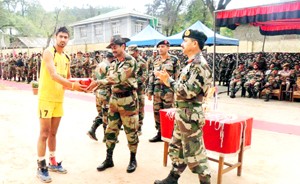 General Officer Commanding Romeo Force, Major General AK Sanyal presenting award to a winner during the concluding ceremony of the Volleyball Tournament at Surankote in Poonch.