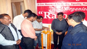 MLC Vibodh Gupta & others lighting lamp during function at Rajouri on Tuesday. 