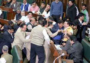 Agitating MLAs being marshalled out of Legislative Assembly on Wednesday.  -Excelsior/Rakesh