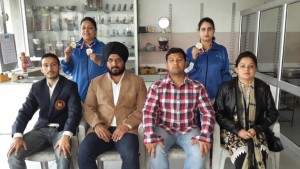 Medal winners of J&K Sports Powerlifting Association posing for a group photograph along with office bearers during felicitation function.