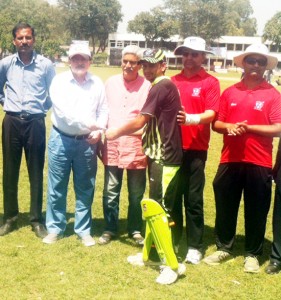 Dr Tej Kaul, former Team India trainer and cricket coach presenting award to a winner during PPCPL match at Science College ground in Jammu.