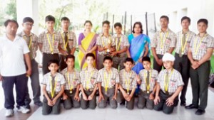 KC Gurukul School cricket team posing after clinching 2nd runners-up trophy in (SSCAF JK) Cricket Championship.