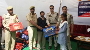 Uniforms and other items being distributed by Ramban Police among the School children on Friday. 