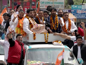 Congress activists alongwith JKPCC chief,  Ghulam Ahmed Mir and new PYC president, Pranav Shagotra, taking out a rally in Jammu on Monday. -Excelsior/Rakesh