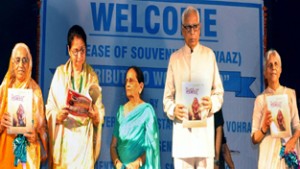 Governor N N Vohra releasing souvenir of ASHI at Government College of Women, Parade.