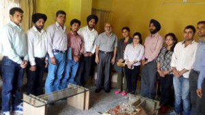 Minister for Education, Naeem Akhtar  and Scholars of JU posing for a photograph at Jammu on Sunday. 