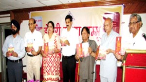 MoS Finance Pawan Gupta and others releasing Neeru Sharma’s book.