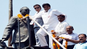 Minister for CA & PD, Ch Zulfkar Ali and others garlanding the statue of Dr B R Ambedkar at Jammu on Sunday. 
