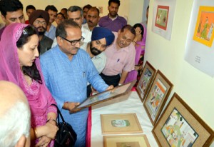 DyCM Dr Nirmal Singh evincing keen interest in Basohli paintings.