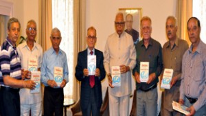 Governor N N Vohra and others releasing book of Veer J. Saraf on Monday.