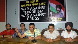 AIATF state president Bharat Bhandari addressing press conference in Jammu.