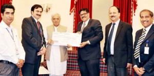 CGM State Bank of India, Lingaraj Mahapatra presenting a cheque to Chief Minister, Mufti Mohd Sayeed on Monday.