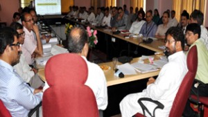 Minister for Health Ch Lal Singh chairing a meeting at Jammu on Monday.