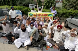 VRS employees staging protest dharna in front of Press Club Jammu on Monday. -Excelsior/Rakesh	