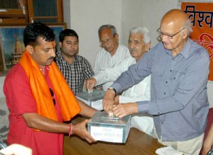 VHP patron Dr Rama Kant Dubey launching quake relief fund at Jammu on Thursday.