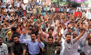 PHE workers staging protest dharna at BC Road Complex in Jammu on Wednesday. — Excelsior/Rakesh