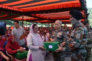 GOC 16  Corps, KH Singh felicitating a ‘Veer Nari’ during Ex-serviceman rally at Mendhar on Wednesday.