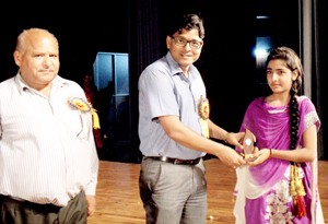 Chief guest felicitating a winner during Annual Day celebration at KV Damana in Jammu on Tuesday.