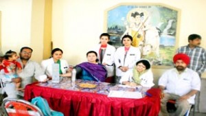 Doctor examining patient during medical camp at Panchbakhtar Temple on Friday.