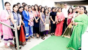 Students of JD Institute posing for group photograph with dignitaries during ‘Fashion Fiesta’ at Jammu on Saturday.