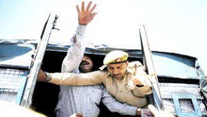 A member of the All Jammu and Kashmir Handicapped Association (AJKHA) shouting slogans as police detains him during a protest in Srinagar on Friday.