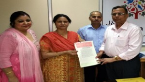 Officials of Grameen Bank and NIACL during signing of MoU at Jammu on Saturday.