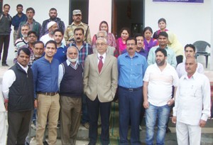 Dignitaries from Dulhasti Power Station and authorities from Govt High School Dumna posing for a photograph during a function.