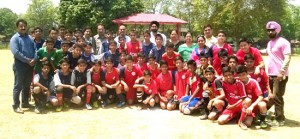 Budding footballers posing along with dignitaries and officials during concluding ceremony of inter-school football tournament at GGM Science College ground on Saturday.