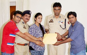 IGP Danesh Rana and DIG Shakeel Beig felicitating talented singers namely Sonali, Nikhil and Rakesh in Jammu on Saturday.