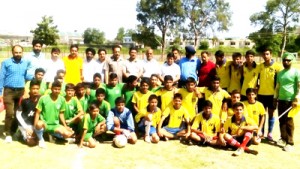 Young footballers posing for a group photograph along with Deputy Director Youth Services and Sports, Jammu on Friday. 