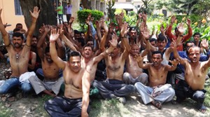 Casual labourers holding protest in support of their demands on Friday.