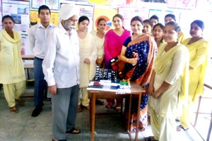  Students and dignitaries during Exhibition cum Workshop at Sant Mela Singh College of Education in Jammu on Monday. 