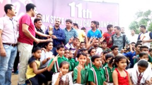 Winners of Wushu Championship posing for a group photograph along with chief guest, Ranjeet Kalra and other dignitaries in Jammu on Thursday.