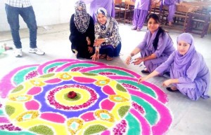 Students making rangoli during CCA Week at Luthra College of Education in Jammu. 