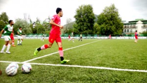 Footballers sweating-it-out during a match of Fanatic Football Tournament at Synthetic Turf, TRC in Srinagar.