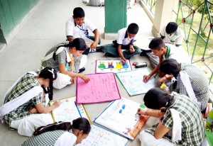 Students busy in making posters at Humanity Public School on Thursday. 