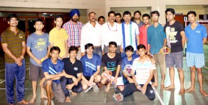 Winners of Badminton Championship posing along with chief guest Ashok Kumar, Director Sports, SMVDSB on Thursday.  