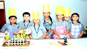 Winners of Extempore and Cooking without Fire Competition posing for a group photograph at Heritage School in Jammu on Thursday. 