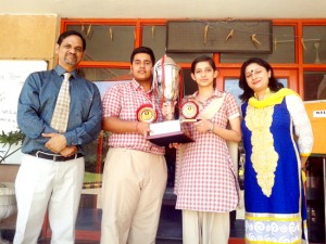 Students of Jodhamal School holding trophy while a photograph along with school Principal.